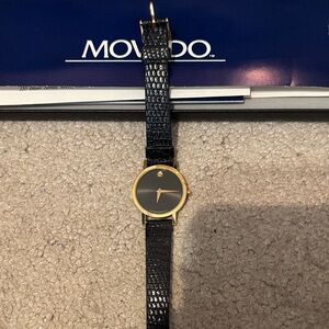 Movado Classic Black and Gold Timepiece